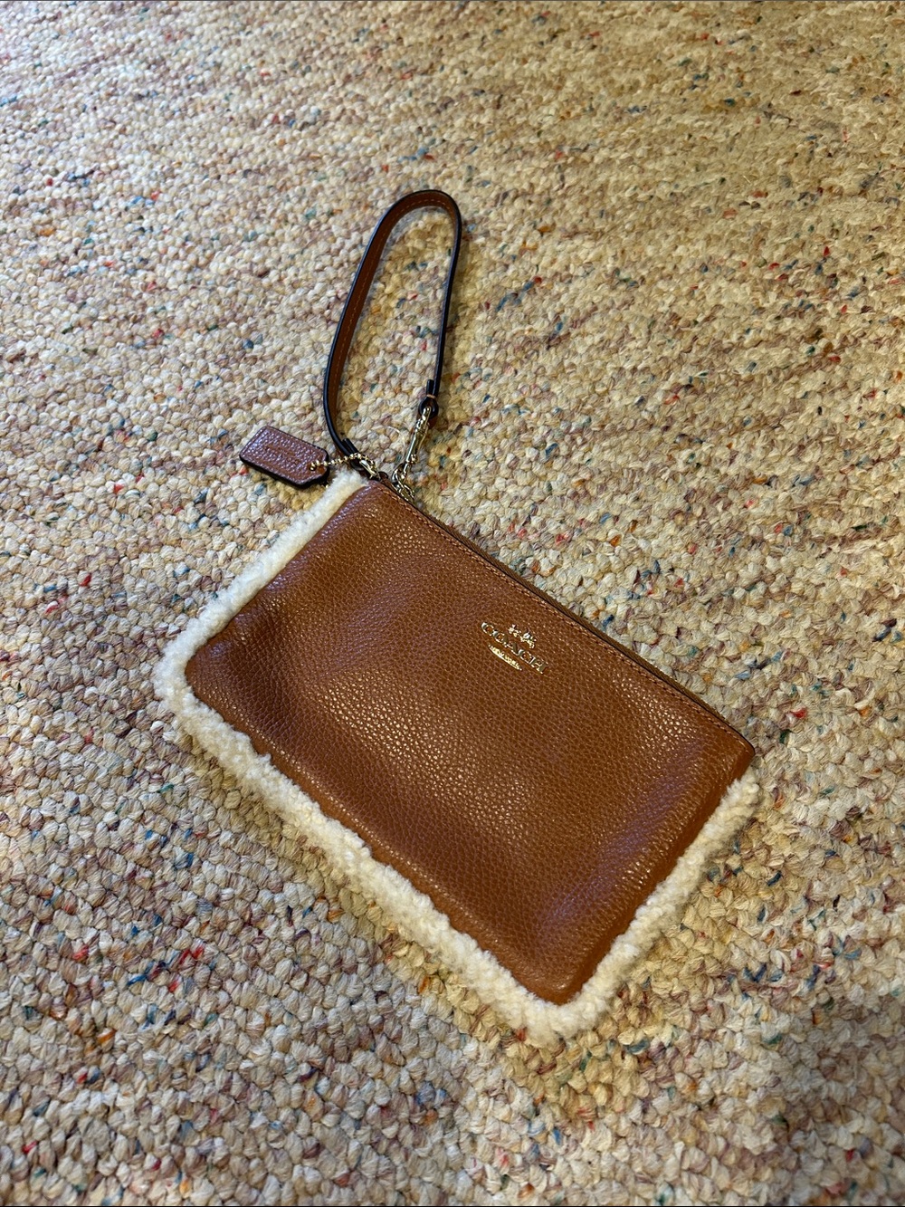 Coach Tan Pebbled Leather Wristlet with Cream Shearling Trim